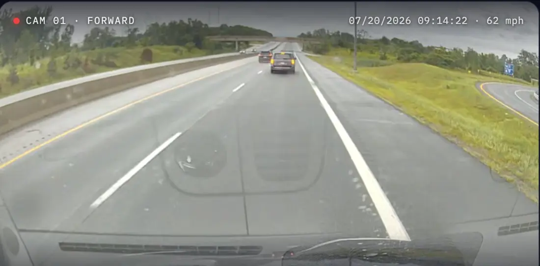 Forward dashcam still on an open highway, three lanes clear ahead, with the camera's own overlay reading CAM 01 · FORWARD and 07/20/2026 09:14:22 · 62 mph.